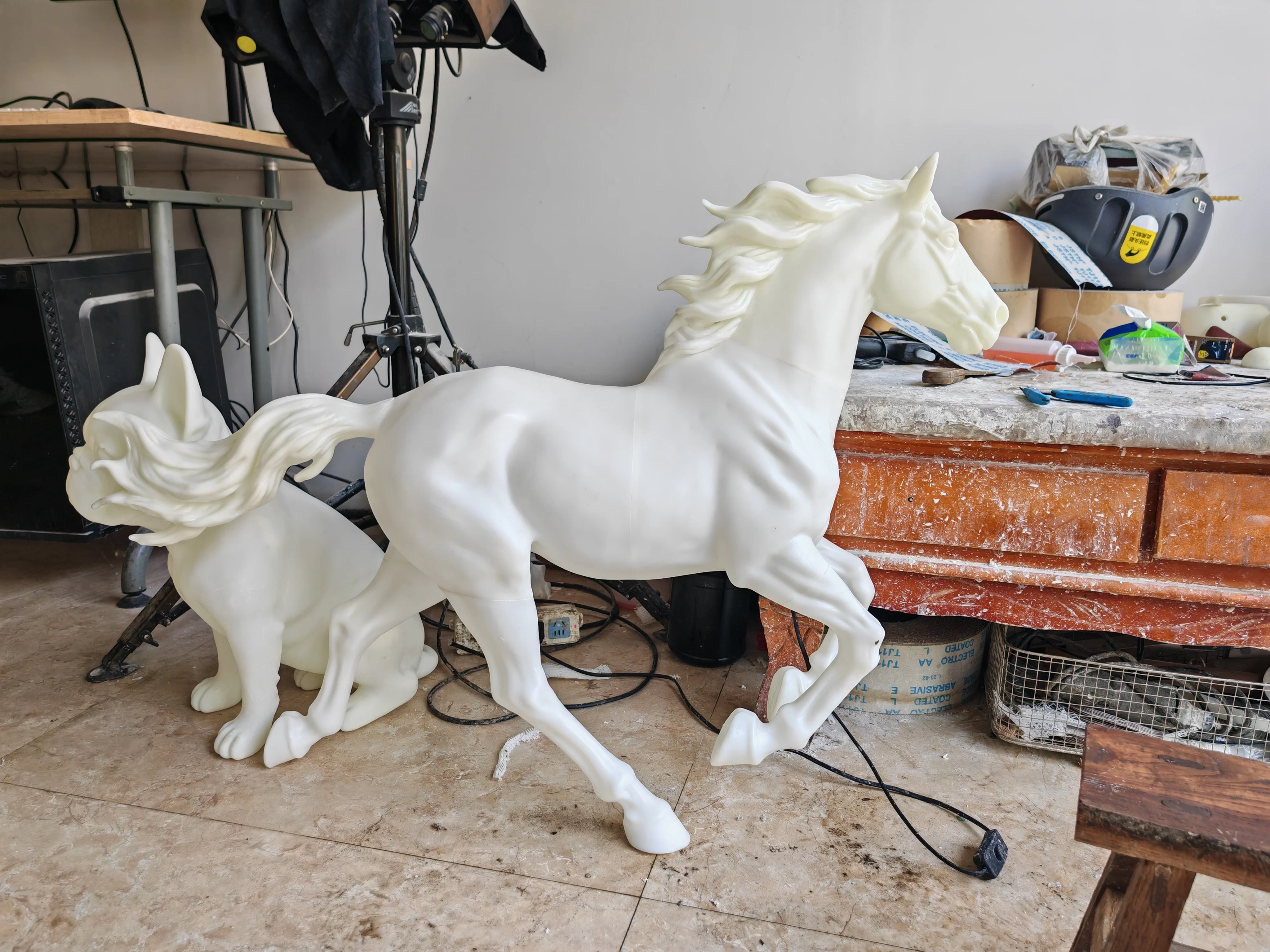 Plaster horse model documented inside the sculpture studio