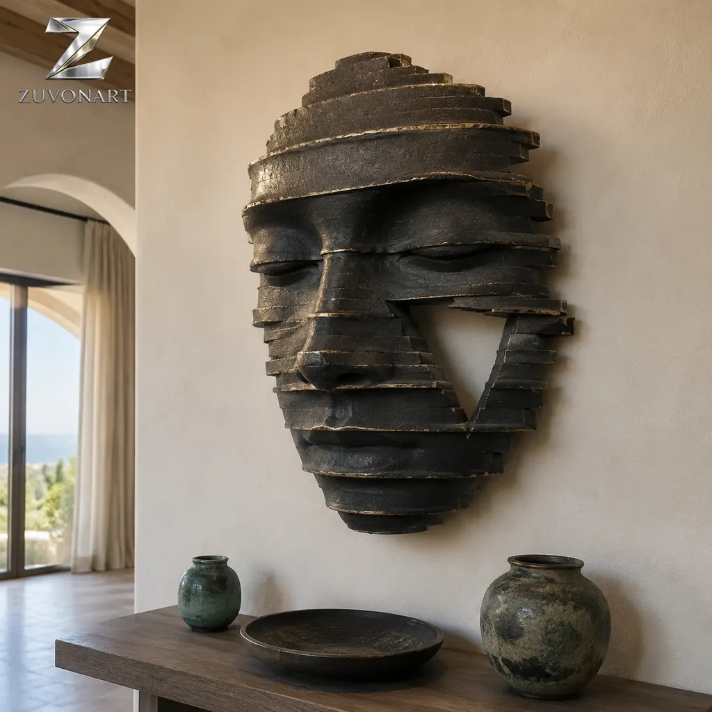 A closed-eye face emerges from layered, contour-like relief bands.