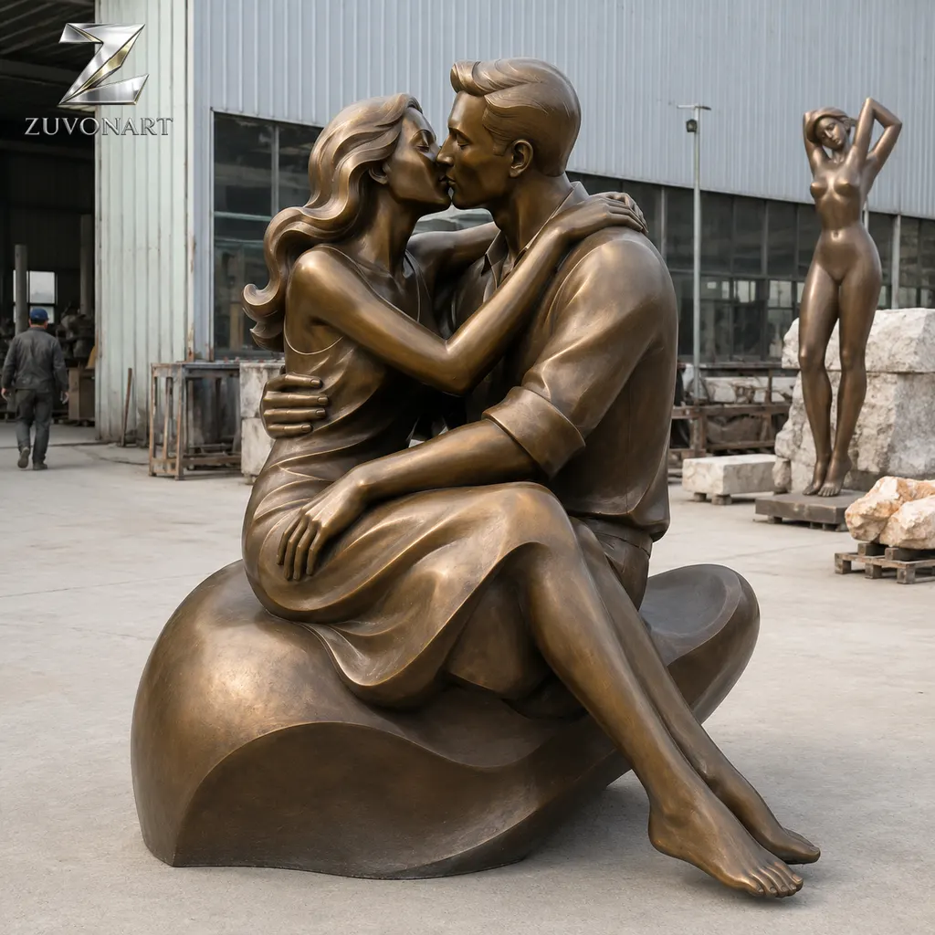 A seated couple is composed around a heart-shaped sculptural gesture.