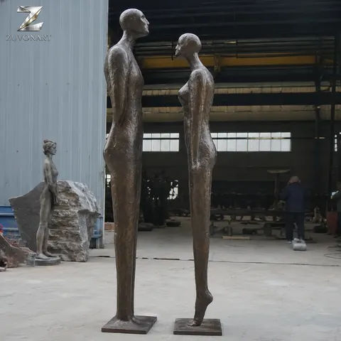 Two slender elongated figures face one another across a narrow gap.