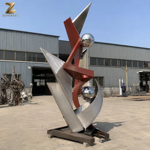 Red and silver angular planes frame a contrasting spherical element.