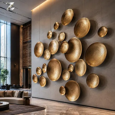 Round textured discs form a wall composition with a hammered gold-tone appearance.